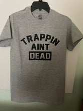 Load image into Gallery viewer, Trappin Ain’t Dead T shirt New
